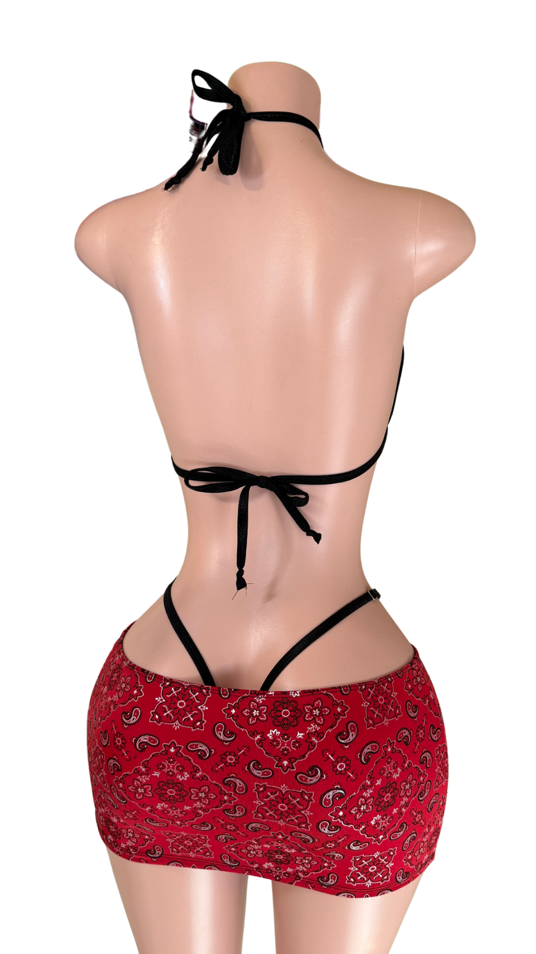 Back of Mannequin wearing red paisley bandana lingerie set with halter top and mini skirt